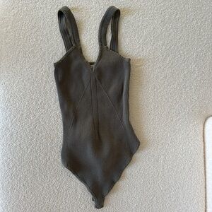 Woman’s olive bodysuit